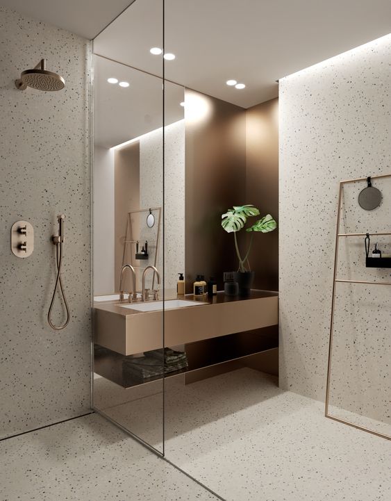 Foto interna de um banheiro mostrando a iluminação geral embutida no forro e a iluminação direta dos spots.